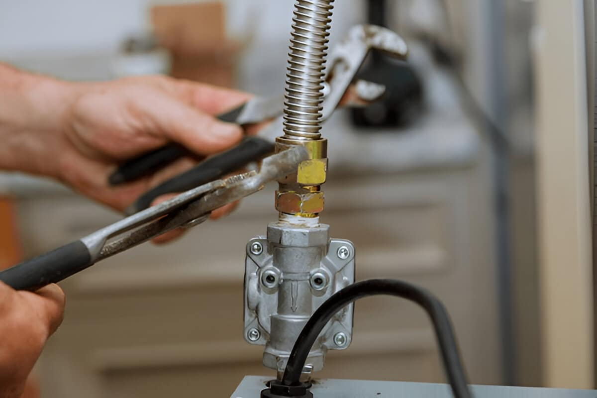 Plumber repairing gas commercial gas line at country club in Carlsbad, CA.